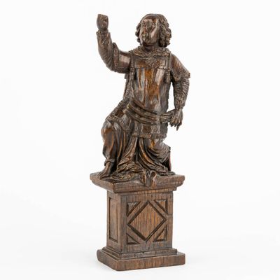 an image of a statue of a man holding a glass