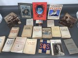 several books on a table with pictures of military men and women