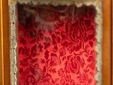 a picture of a picture of a red and gold wall