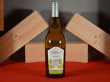 a bottle of wine that is sitting on a table