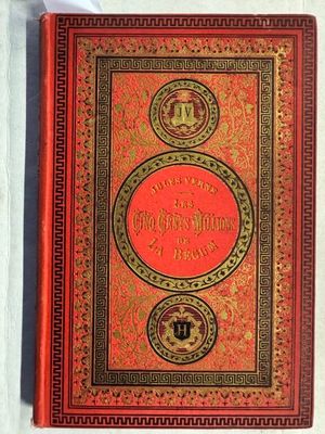 un vieux livre rouge aux tranches dorées et à la couverture rouge