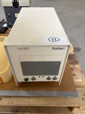 a white microwave sitting on top of a wooden pallet
