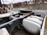 a truck that has been flipped over in the dirt
