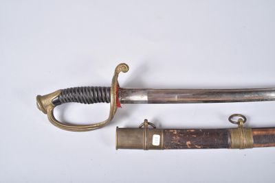 a knife that is laying on a table next to another knife