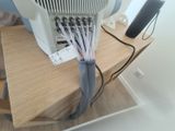 a small air conditioner sitting on top of a wooden table