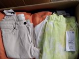 a box full of clothing that is sitting on the floor