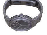 a watch that is sitting on a metal bracelet
