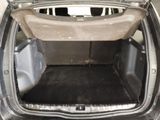 a trunk of a car with the back door open