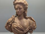 une image représentant le buste d'une femme avec une fleur dans les cheveux