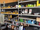 many shelves with various items on them in a garage