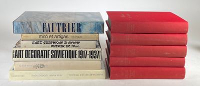 several books stacked on top of each other on a white surface