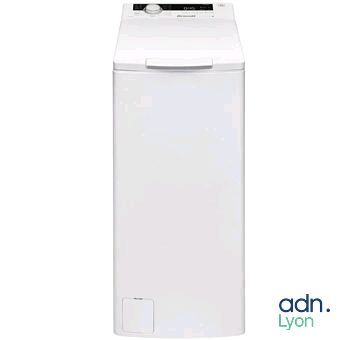 a white washing machine sitting on top of a white counter