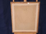 painting on a wooden easel against a blue backdrop