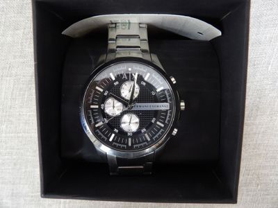 a watch that is in a box on a table