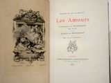 an open book with a picture of a statue on it