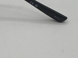 a pair of glasses on a white surface with a black handle