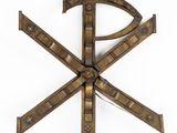 a large metal object with a cross on top of it