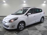 a picture of a white minivan parked in a garage