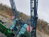 a crane that is sitting on the side of the road