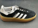a close up of a pair of black and white sneakers
