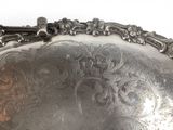 a silver tray that has a handle on it