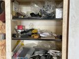 a wooden cabinet filled with lots of shoes and shoes