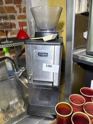 many cups that are sitting on a counter