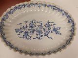a blue and white plate sitting on a table