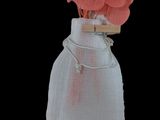 a small bag with flowers in it on a black background