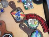 a picture of a table with a lot of badges on it