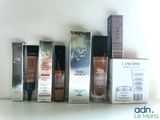 many different types of makeup products on a shelf