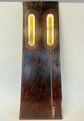 a clock that is on a table with a clock on it