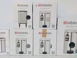several boxes of coffee machines are stacked on top of each other