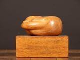 a close up of a wooden object on a wooden surface