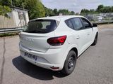 a white car that is parked on the side of the road