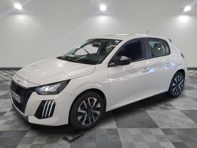 the white car is parked on a checkered floor in a room