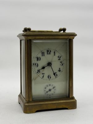 a small clock that is sitting on a table