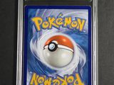 a close up of a card with a pokemon ball on it