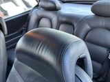 a black leather seat in the back of a car