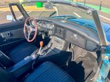 a view of the interior of a car from the driver ' s seat