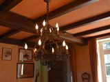 a chandelier hanging from the ceiling in a living room
