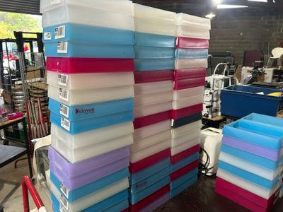 many boxes stacked on top of each other on a table