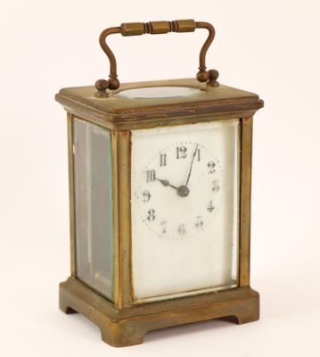 a small clock that is sitting on top of a table