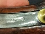 a close up of a person holding a knife in their hand