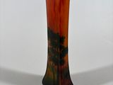 a vase that has a picture of a tree on it