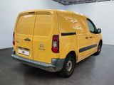 a yellow van that is parked in a room