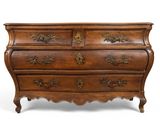 an antique chest of drawers with ornate carvings on the drawers