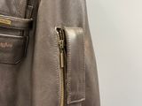 a brown leather jacket with a zipper on it