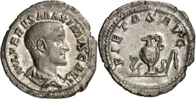 a silver coin with an image of a man and a bird on it