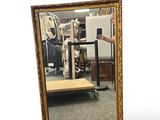a mirror that is sitting on a table in a room